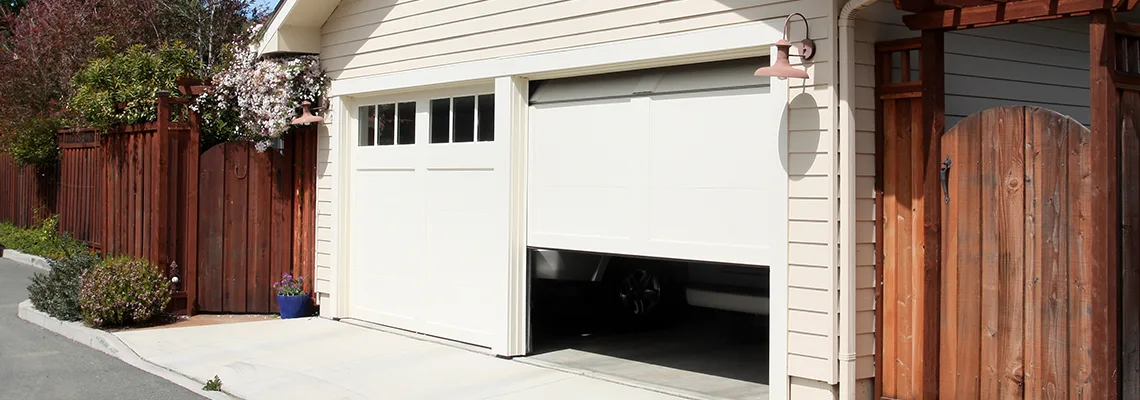 Fix Metal Garage Door Jerking in O'Fallon, Illinois